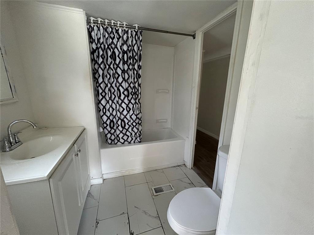 4265 North Beginning Path Crystal River, FL 34428 - Photo 14 of 18 a bathroom with a sink toilet and shower