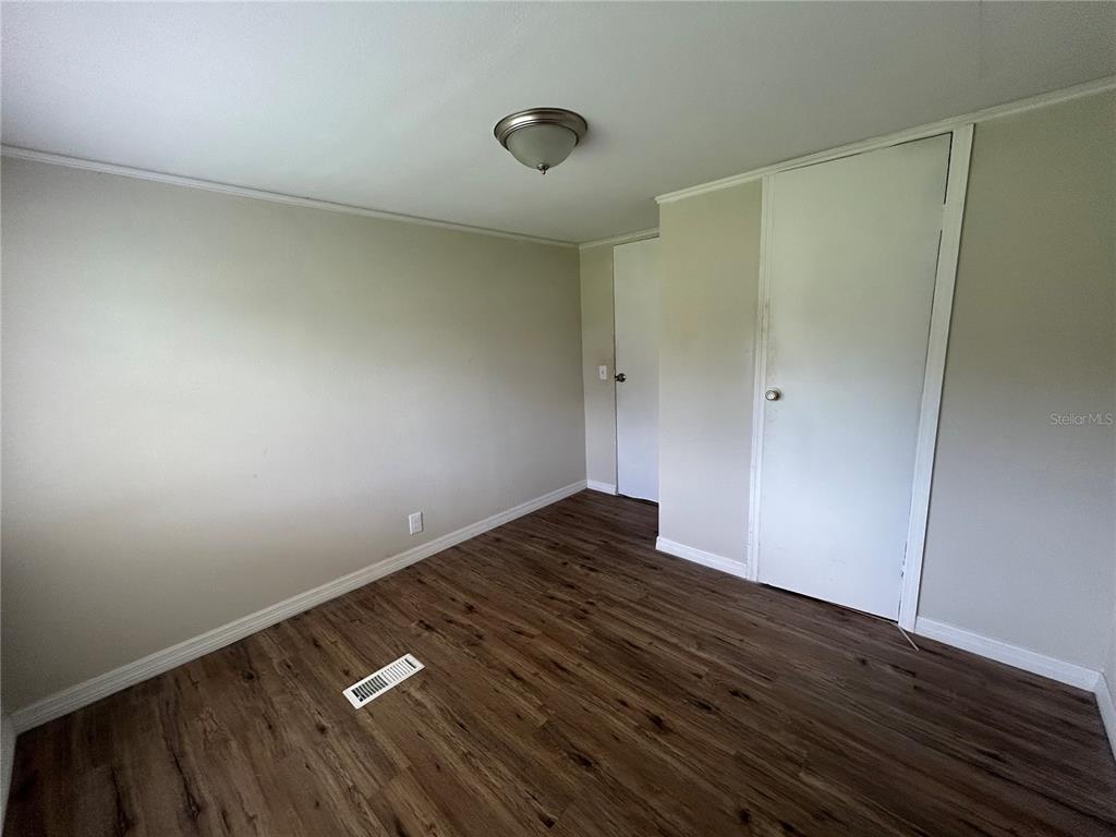 4265 North Beginning Path Crystal River, FL 34428 - Photo 9 of 18 a view of an empty room and wooden floor