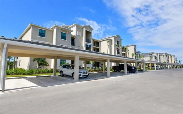 a view of a building with a bench in front of it