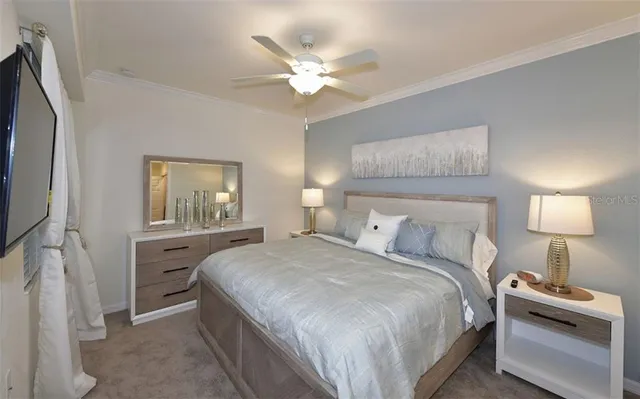 a bedroom with a bed and a lamp