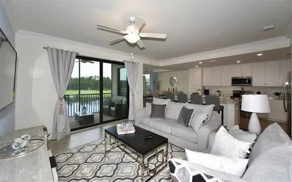 a living room with furniture and a large window