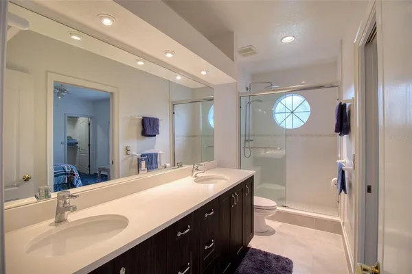 a bathroom with a sink vanity and a mirror