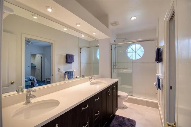 a bathroom with a sink vanity and a mirror