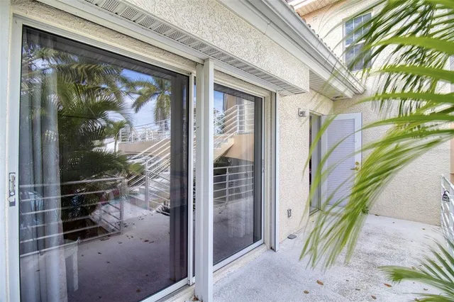a building outdoor view with a sitting space and glass windows