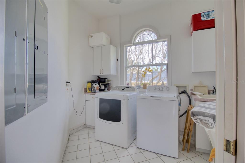 131 13th Street East Tierra Verde, FL 33715 - Photo 27 of 54 a view of open kitchen with granite countertop a sink a stove and a refrigerator