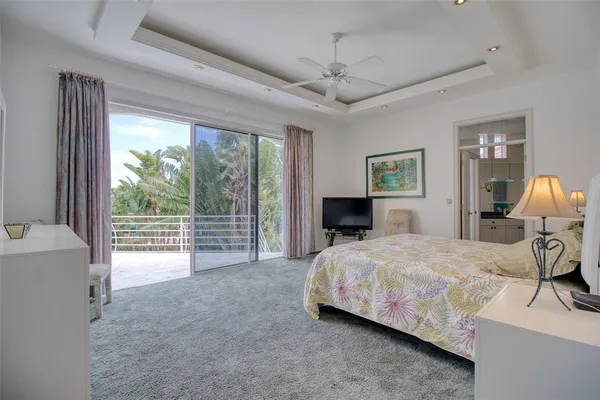 a large bathroom with a tub sink and mirror