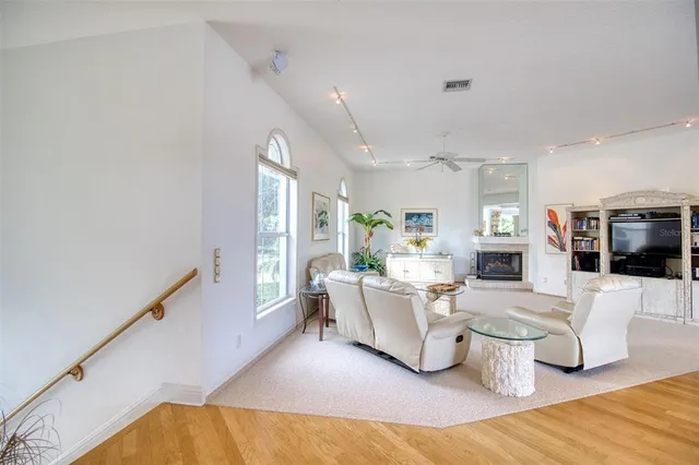 a living room with fireplace furniture and a flat screen tv