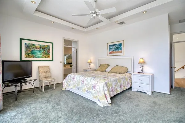 a bathroom with a granite countertop toilet a sink and a mirror