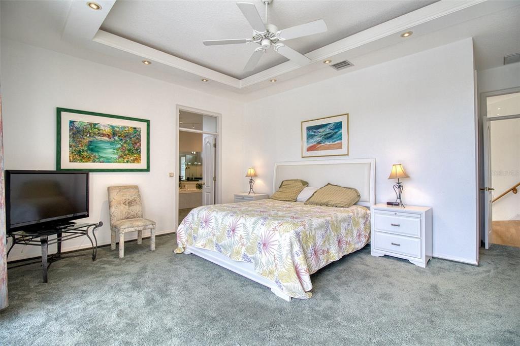 131 13th Street East Tierra Verde, FL 33715 - Photo 31 of 54 a bedroom with a bed and a flat screen tv