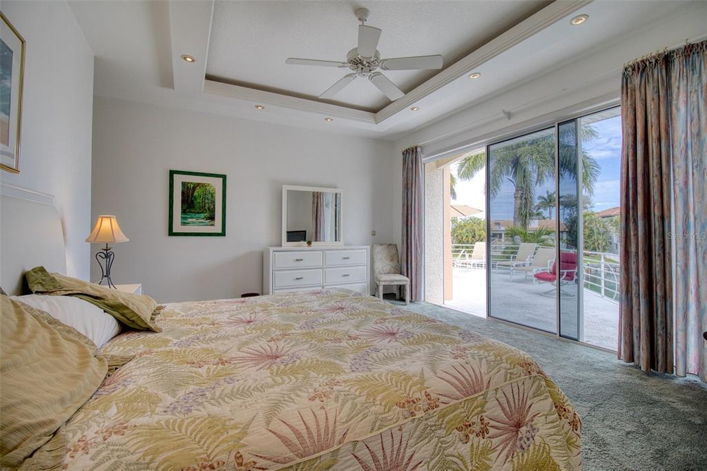 131 13th Street East Tierra Verde, FL 33715 - Photo 32 of 54 a bedroom with a large bed and a window