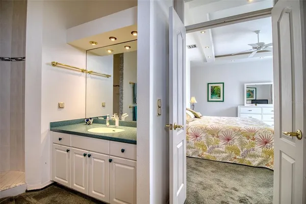 a bathroom with a glass shower door