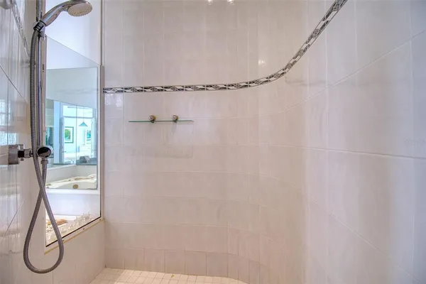 a view of swimming pool from a living room