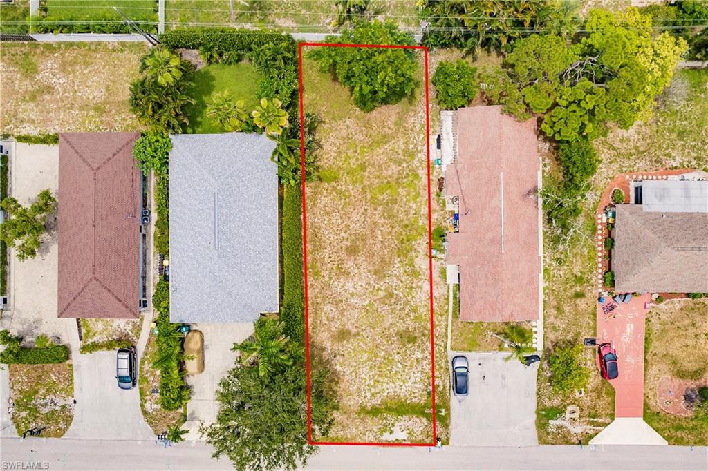 635 92nd Avenue North Naples, FL 34108 - Photo 1 of 6 Aerial view of residential area featuring property parcel outlined