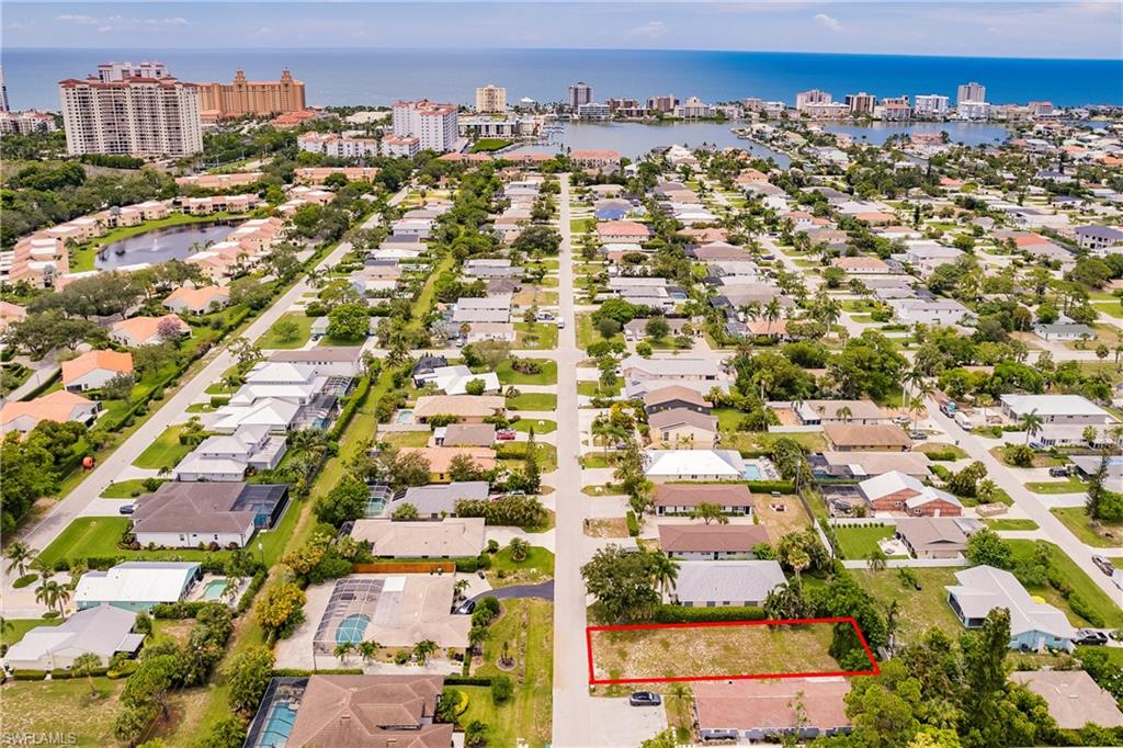 635 92nd Avenue North Naples, FL 34108 - Photo 3 of 6 View of urban area featuring property boundaries highlighted and nearby suburban area