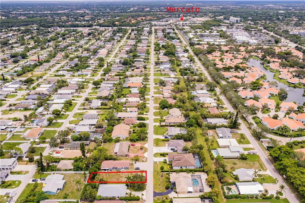 635 92nd Avenue North Naples, FL 34108 - Photo 4 of 6 Aerial perspective of suburban area featuring property parcel outlined