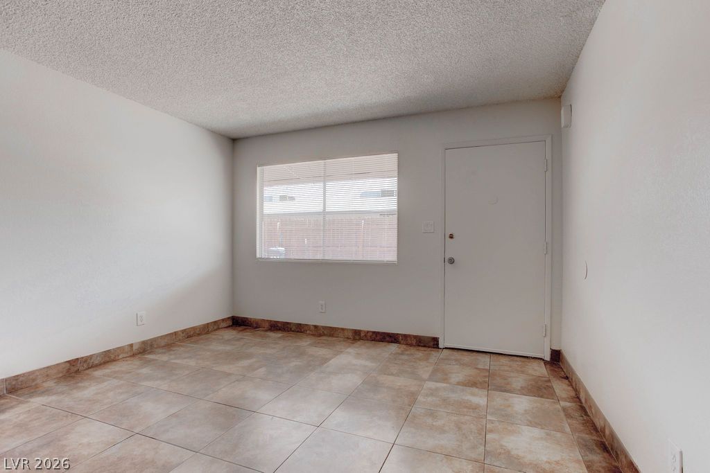 421 North Decatur Boulevard, Unit 2 Las Vegas, NV 89107 - Photo 7 of 21 Functional entry space offers durable tile flooring, setting a practical tone for the interior.