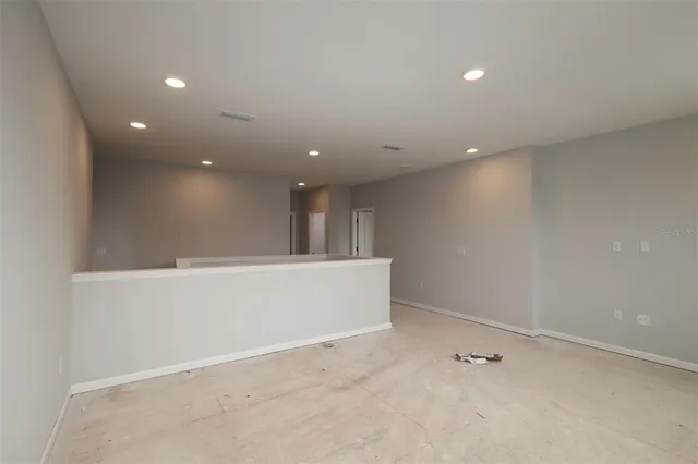 wooden floor and window in an empty room