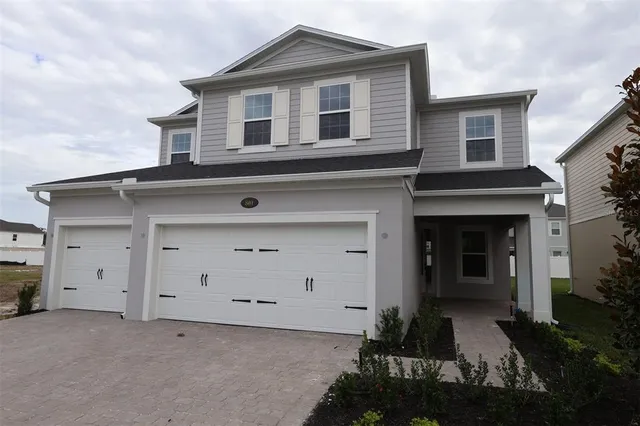 front view of a house with a yard