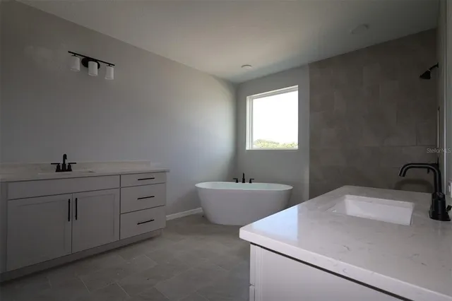 a bathroom with a sink and mirror
