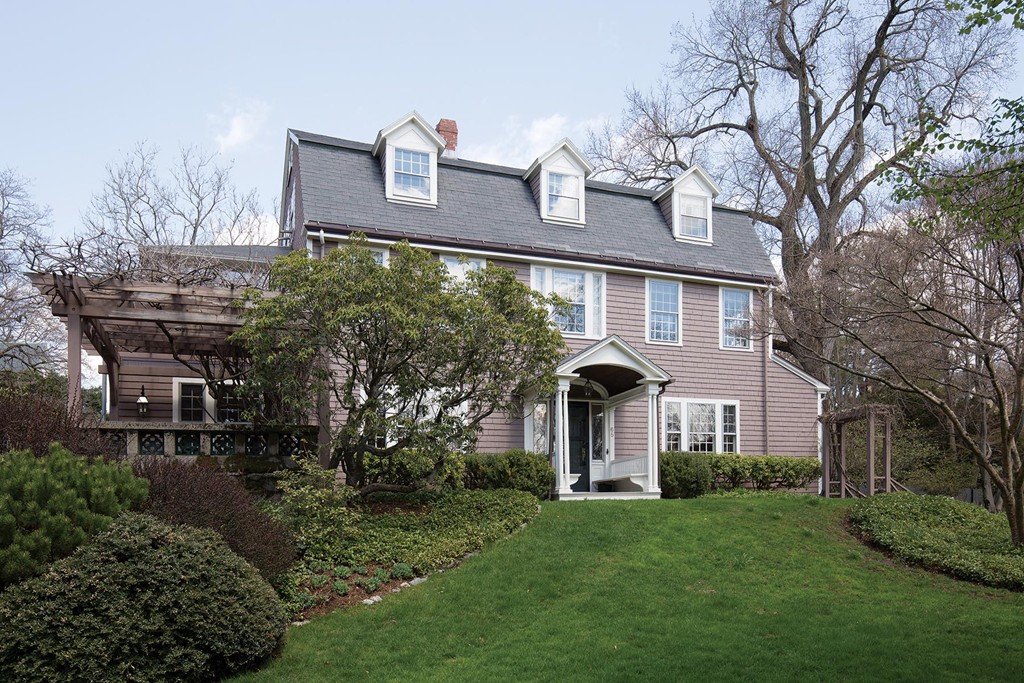 65 Suffolk Road Newton, MA 02467 - Photo 1 of 17 a front view of a house with a garden