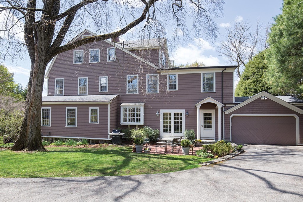 65 Suffolk Road Newton, MA 02467 - Photo 13 of 17 a front view of a house with garden and porch