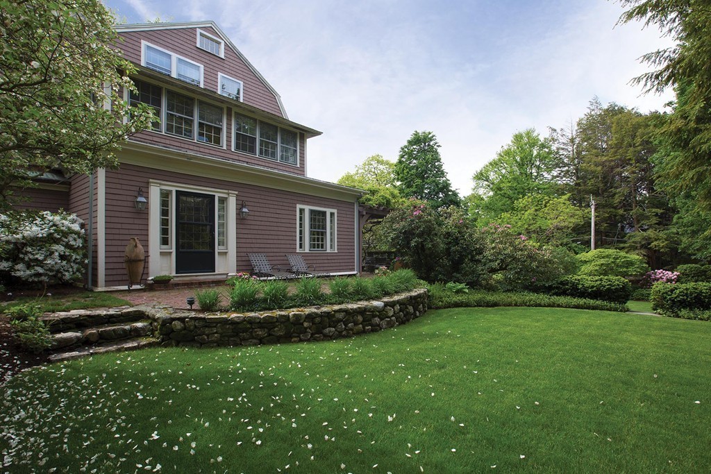 65 Suffolk Road Newton, MA 02467 - Photo 14 of 17 a front view of a house with a garden