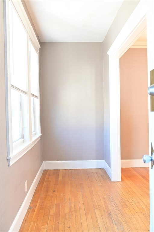 90 Elmer Road, Unit 2 Boston, MA 02124 - Photo 3 of 12 a view of an empty room and window