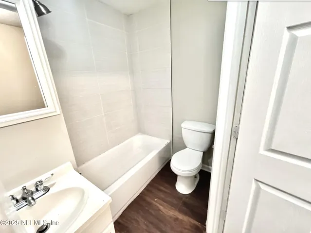 a bathroom with a toilet and a sink