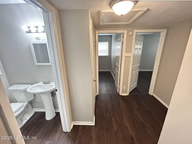 view of a room with wooden floor and chair