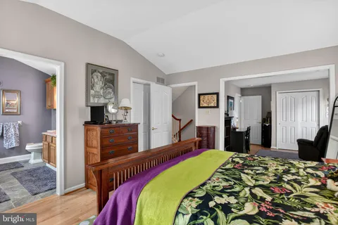 a bed room with a bed and a television