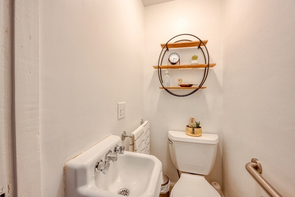 87 Conant Street Danvers, MA 01923 - Photo 12 of 31 a bathroom with a toilet and a sink
