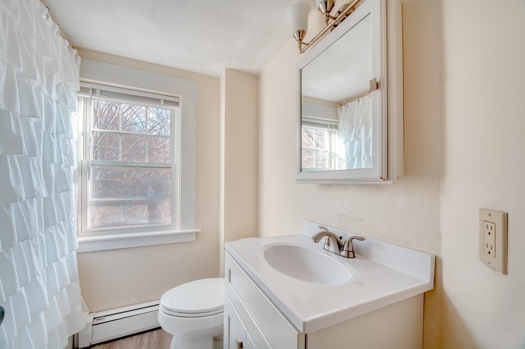 87 Conant Street Danvers, MA 01923 - Photo 17 of 31 a bathroom with a sink and a toilet