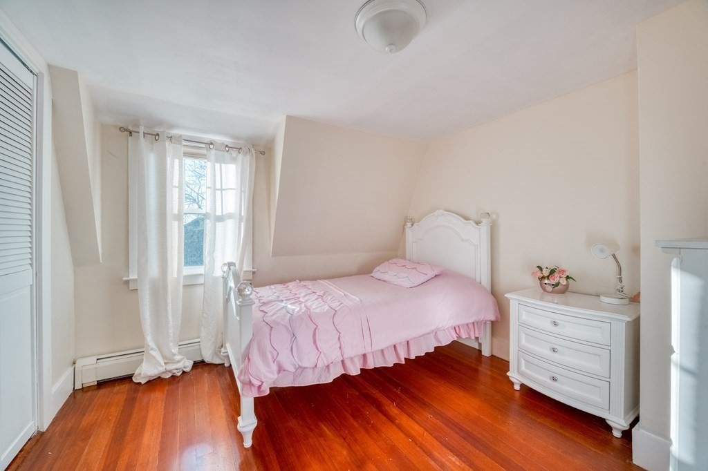 87 Conant Street Danvers, MA 01923 - Photo 18 of 31 a bedroom with a bed and a closet