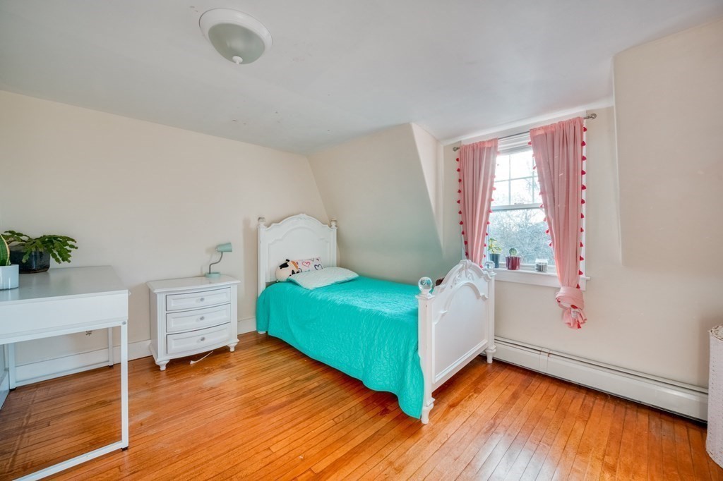 87 Conant Street Danvers, MA 01923 - Photo 19 of 31 a bedroom with a bed and a window