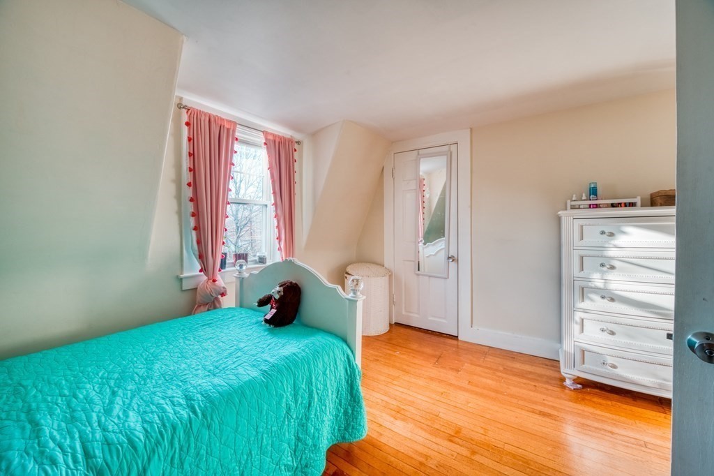 87 Conant Street Danvers, MA 01923 - Photo 20 of 31 a bedroom with a bed and a window