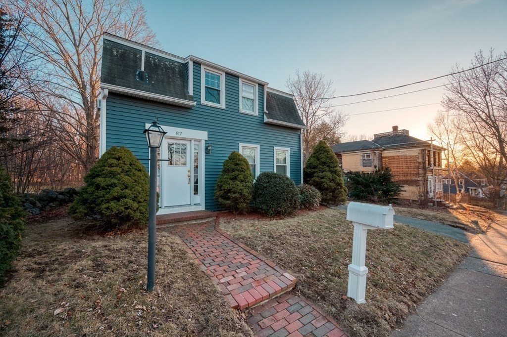 87 Conant Street Danvers, MA 01923 - Photo 23 of 31 a front view of a house with a yard