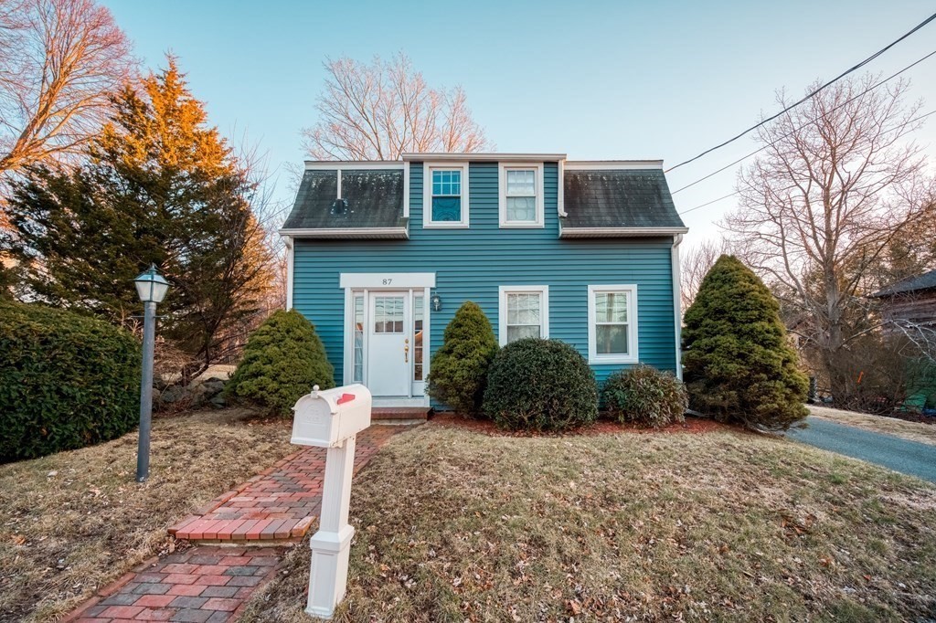 87 Conant Street Danvers, MA 01923 - Photo 24 of 31 a front view of a house with a yard