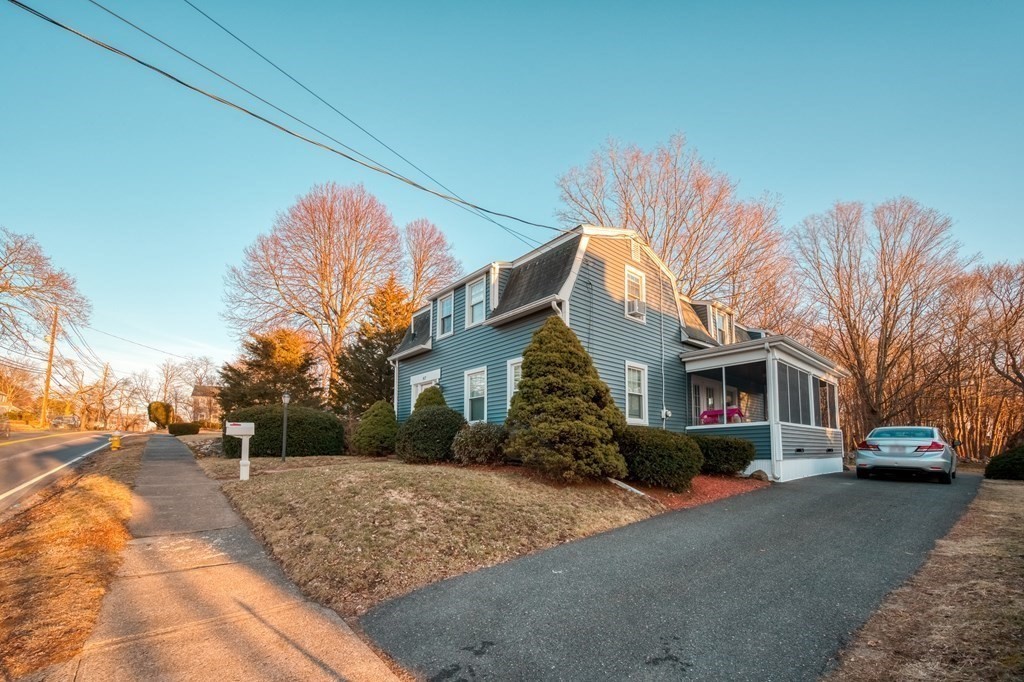 87 Conant Street Danvers, MA 01923 - Photo 25 of 31 a front view of a house with a yard and tree s