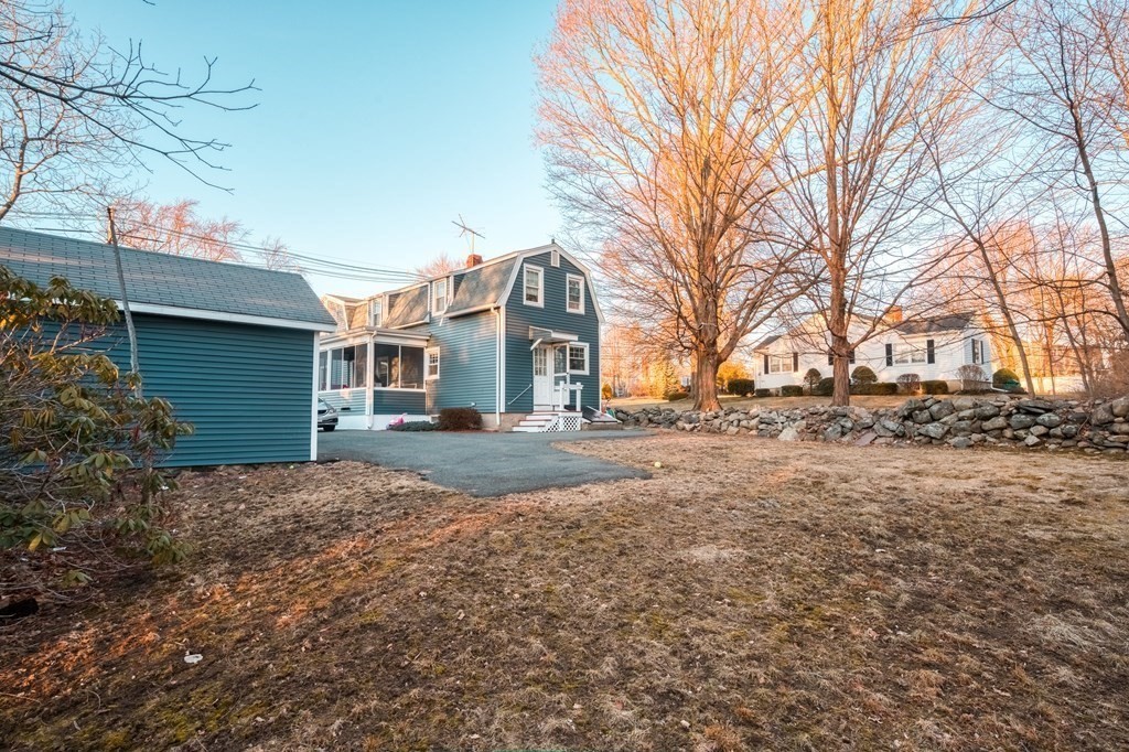 87 Conant Street Danvers, MA 01923 - Photo 29 of 31 a view of a yard with a large tree