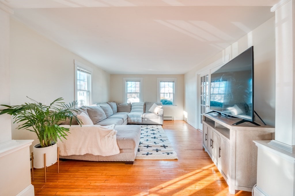 87 Conant Street Danvers, MA 01923 - Photo 6 of 31 a living room with furniture and a flat screen tv
