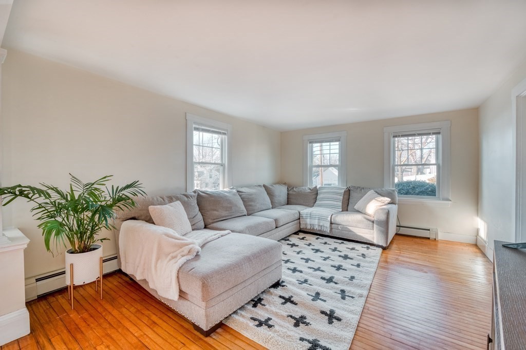 87 Conant Street Danvers, MA 01923 - Photo 7 of 31 a living room with furniture and a potted plant