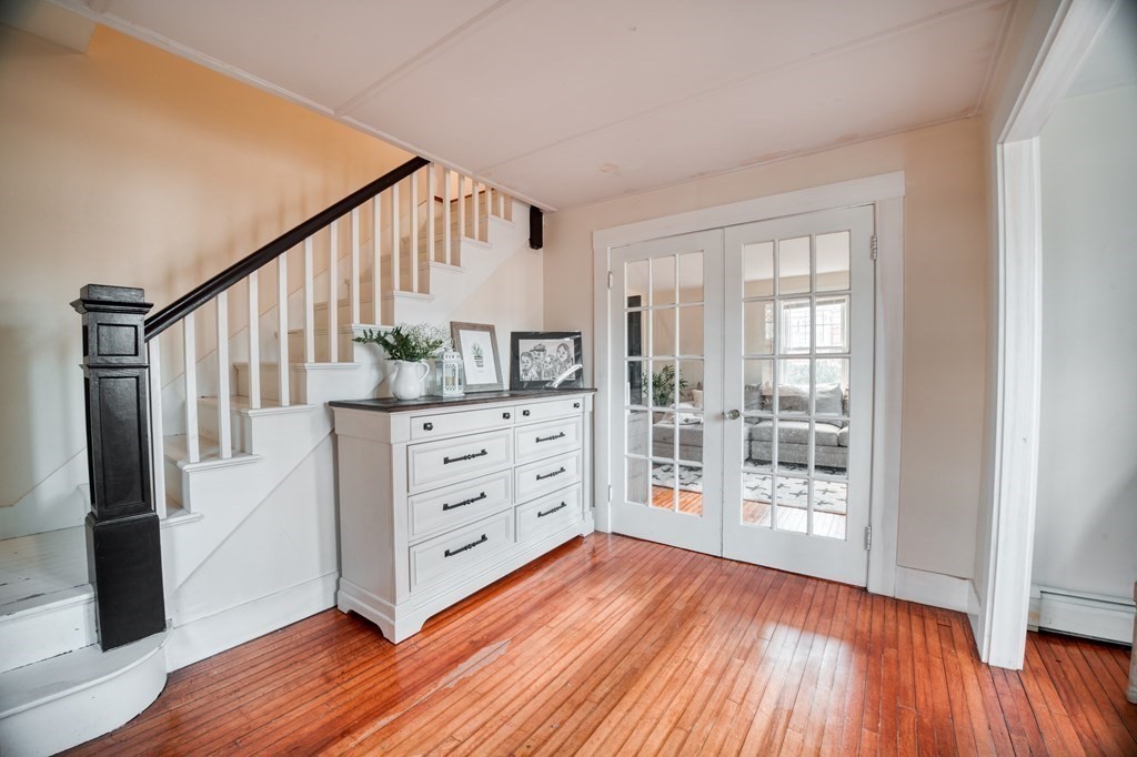 87 Conant Street Danvers, MA 01923 - Photo 10 of 31 an empty room with wooden floor and windows