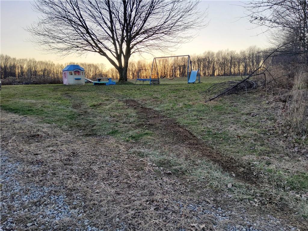 105 Fredonia Road Mercer, PA 16137 - Photo 4 of 11 a view of a field with large trees