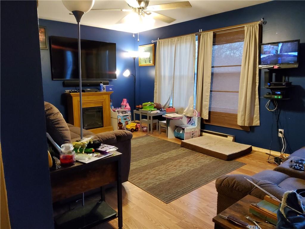 105 Fredonia Road Mercer, PA 16137 - Photo 5 of 11 a living room with furniture flat screen tv and a large window