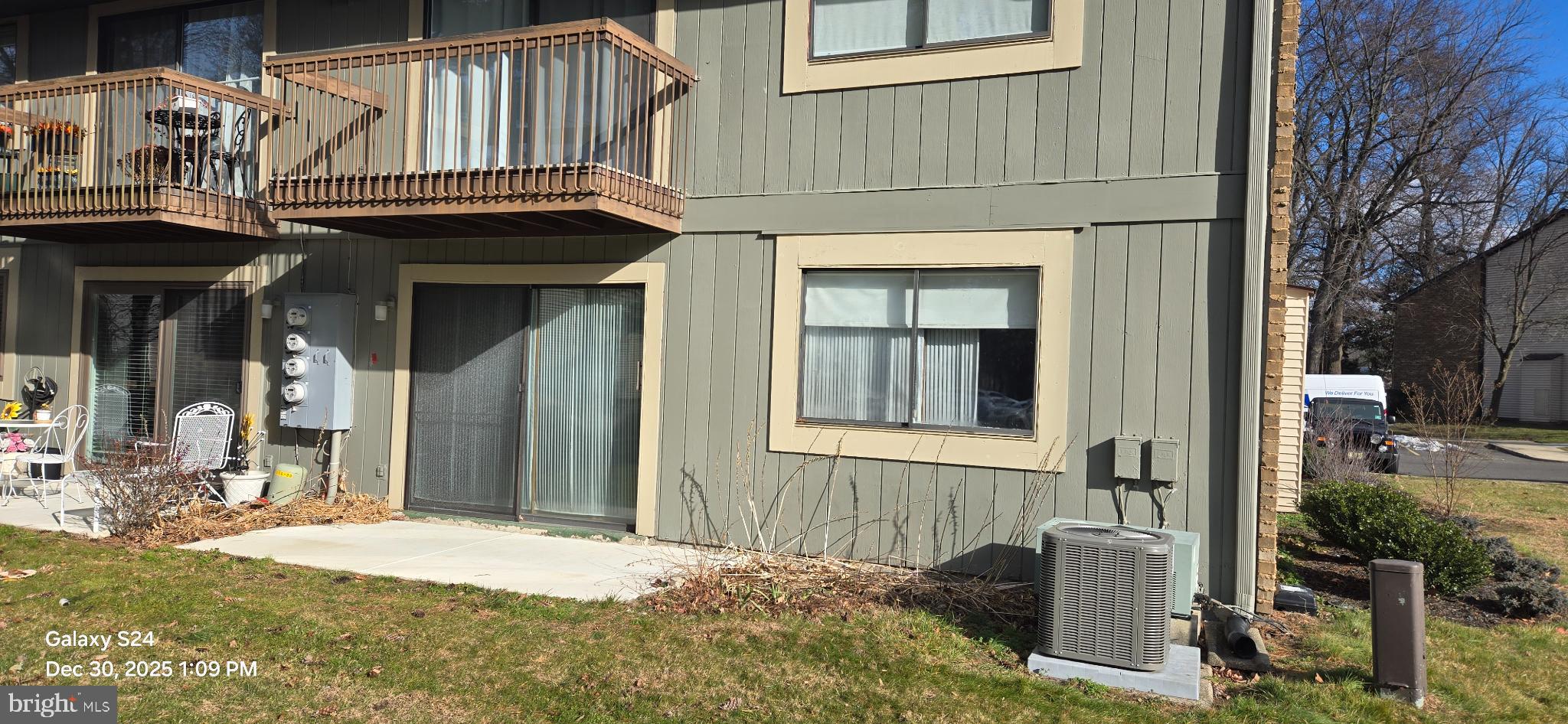 115 East Kings Highway, Unit 211 Maple Shade, NJ 08052 - Photo 2 of 10 a front view of a house with a yard