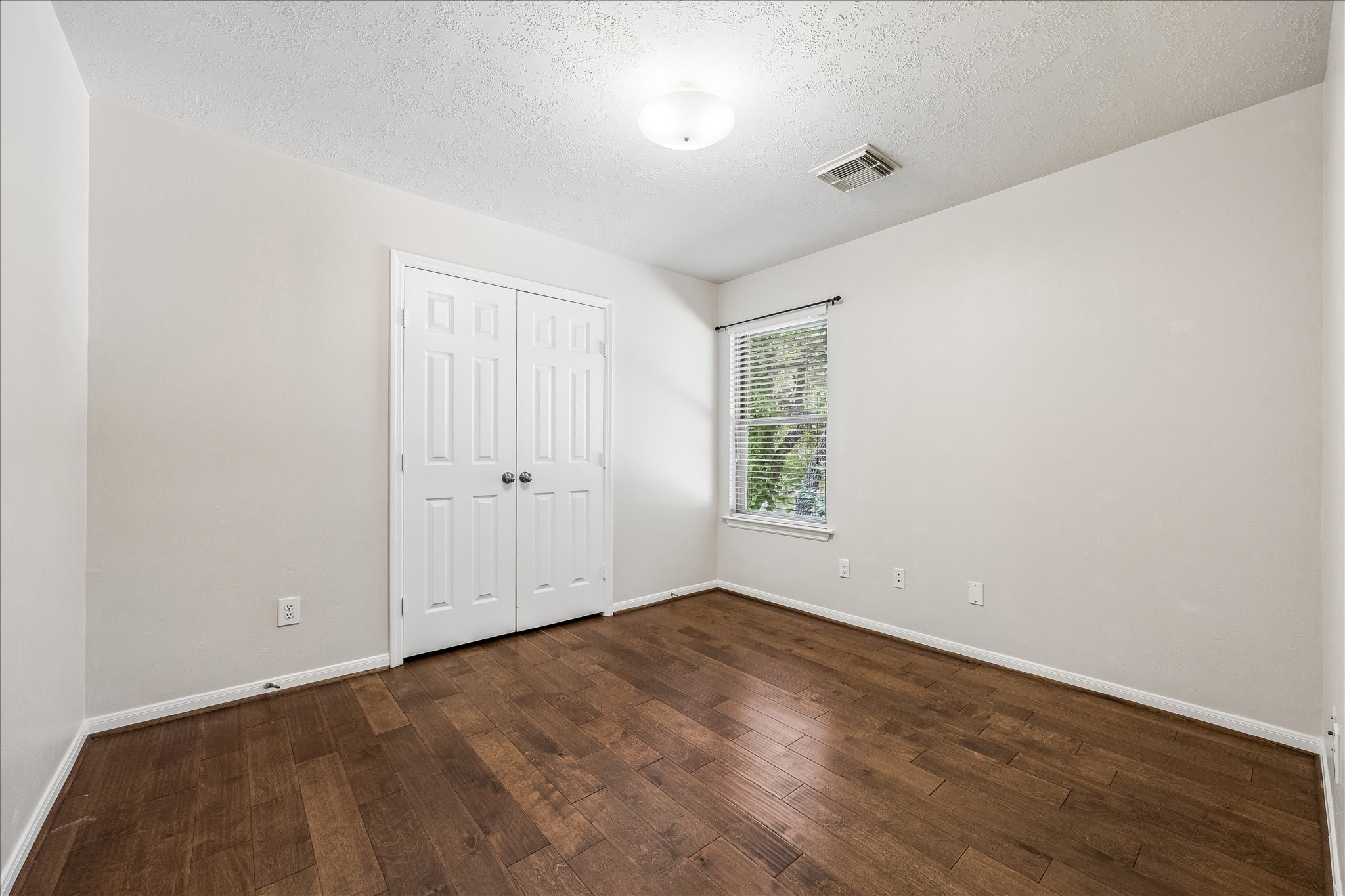 5811 Walkabout Way Katy, TX 77450 - Photo 24 of 33 Spacious secondary bedroom offering flexibility for guests, family, or a dedicated home office.