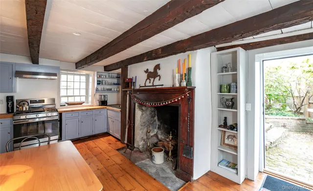 a kitchen with a stove and a refrigerator