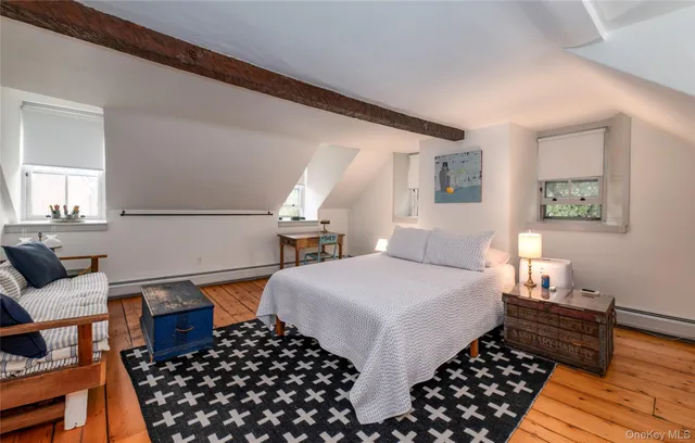 a bedroom with bed and window