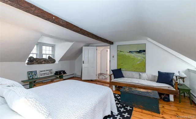 a bed room with a bed and a chair