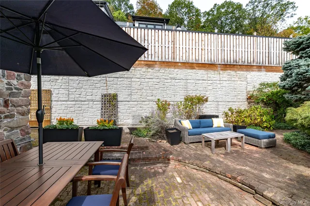 a aerial view of a house with a yard and potted plants